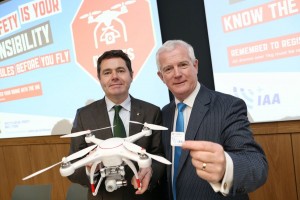 17/12/2015 NO REPRO FEE, PIC MAXWELLS/JULIEN BEHAL The Irish Aviation Authority (IAA) today announced new Drone legislation which includes the mandatory registration of all drones weighing 1Kg or more from Monday 21st December 2015.Picture shows Minister for Transport,Trade and Tourism Paschal Donohoe TD with Ralph James IAA Director Safety Regulation holding a drone in the offices of the IAA in Dublin.From 21st December all drones weighing 1kg or more must be registered with the IAA via www.iaa.ie/drones MORE INFO CONTACT Dave Curtin 086-2832123 PIC MAXWELLS/NO FEE